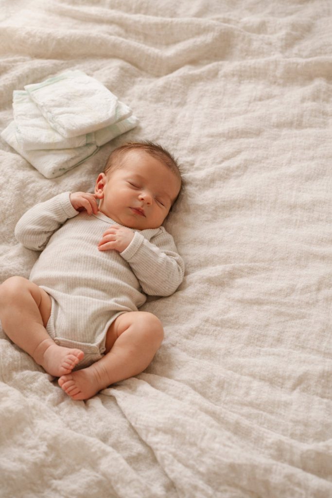 best diapers for newborns clean soft disposable diapers for sensitive skin laid on neutral blanket