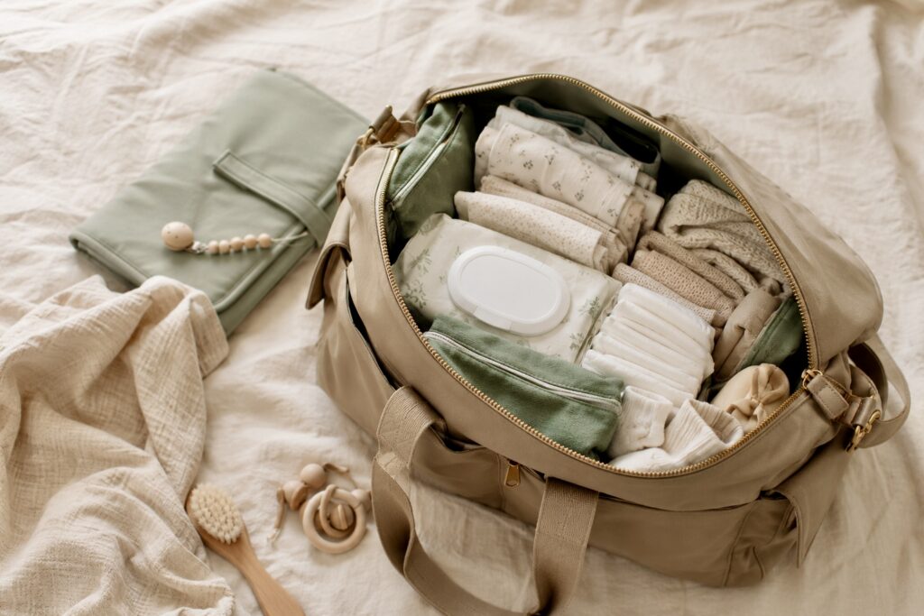 Organized diaper bag with extra baby clothes and everyday diaper bag essentials.